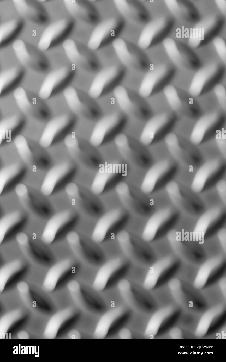 Die Oberfläche der massiven Diamant-Metallplatte zeigt Edelstahlböden in der industriellen Fertigung als Steampunk-Hintergrund für Metalltreppen und schweren Stahl Stockfoto