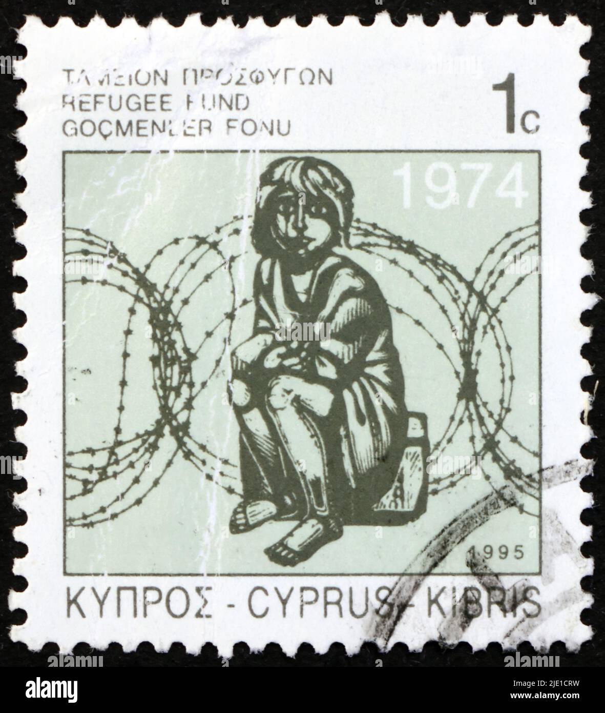 ZYPERN - UM 1995: Eine in Zypern gedruckte Marke zeigt Child and Barbed Wire, um 1995 Stockfoto