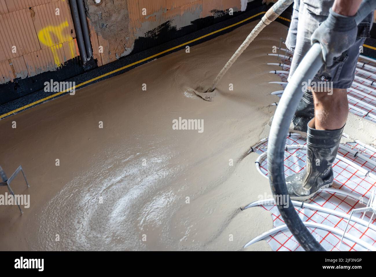 Fußbodenklempner Heizsystem, Fußbodenklempner Heizkonzept, ein Gebäudekonzept Stockfoto