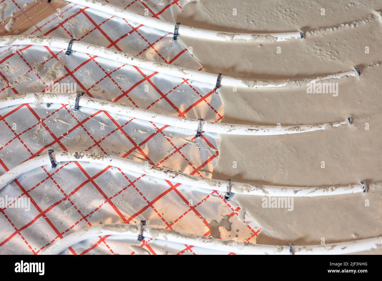Fußbodenklempner Heizsystem, Fußbodenklempner Heizkonzept, ein Gebäudekonzept Stockfoto