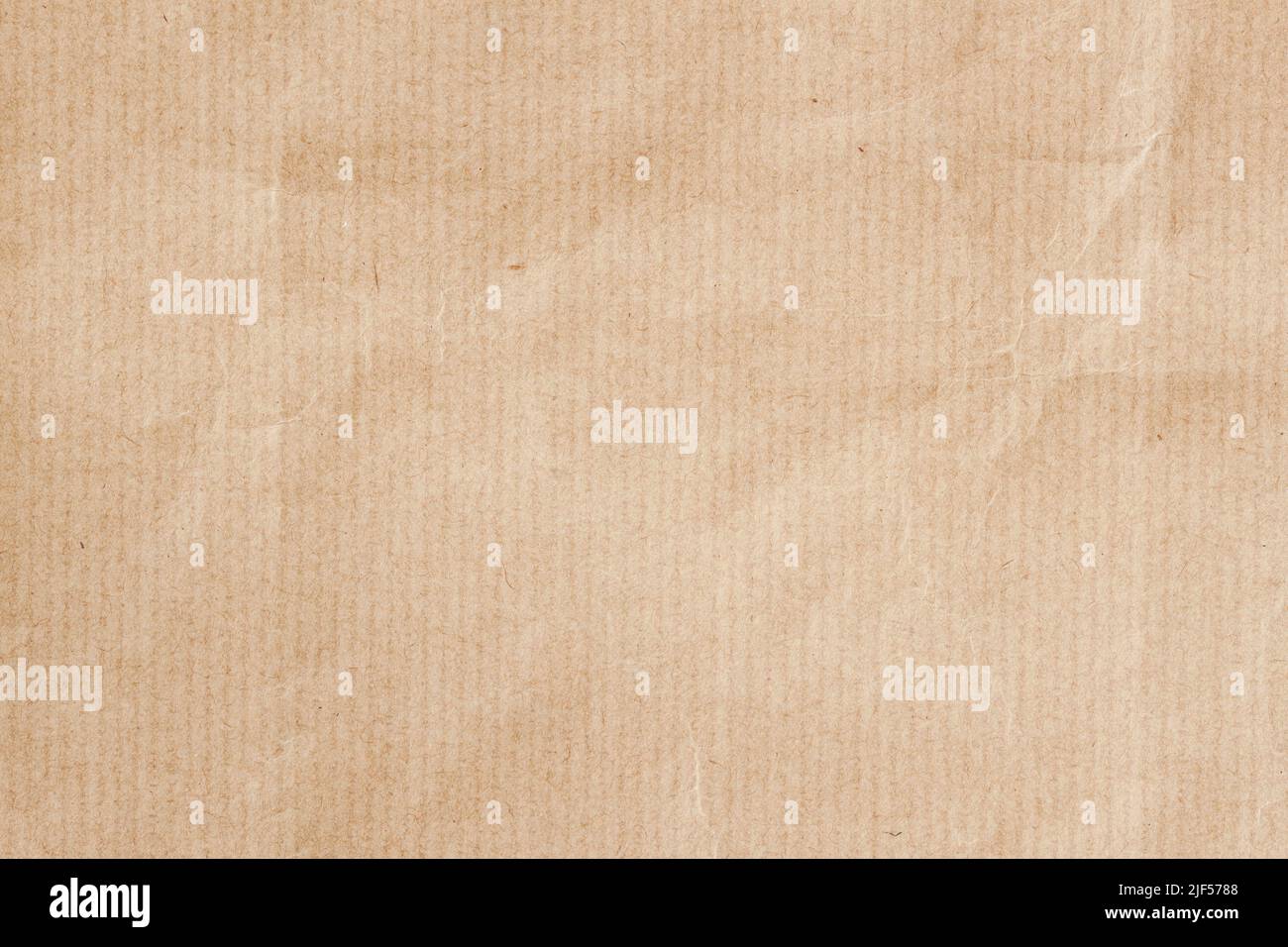 Basteln Sie Papier mit vertikalen Streifen. Natürliche raue strukturierte Papier Hintergrund Nahaufnahme Stockfoto