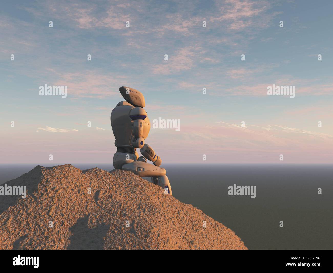 Roboter sitzt auf einem Felsen Stockfoto