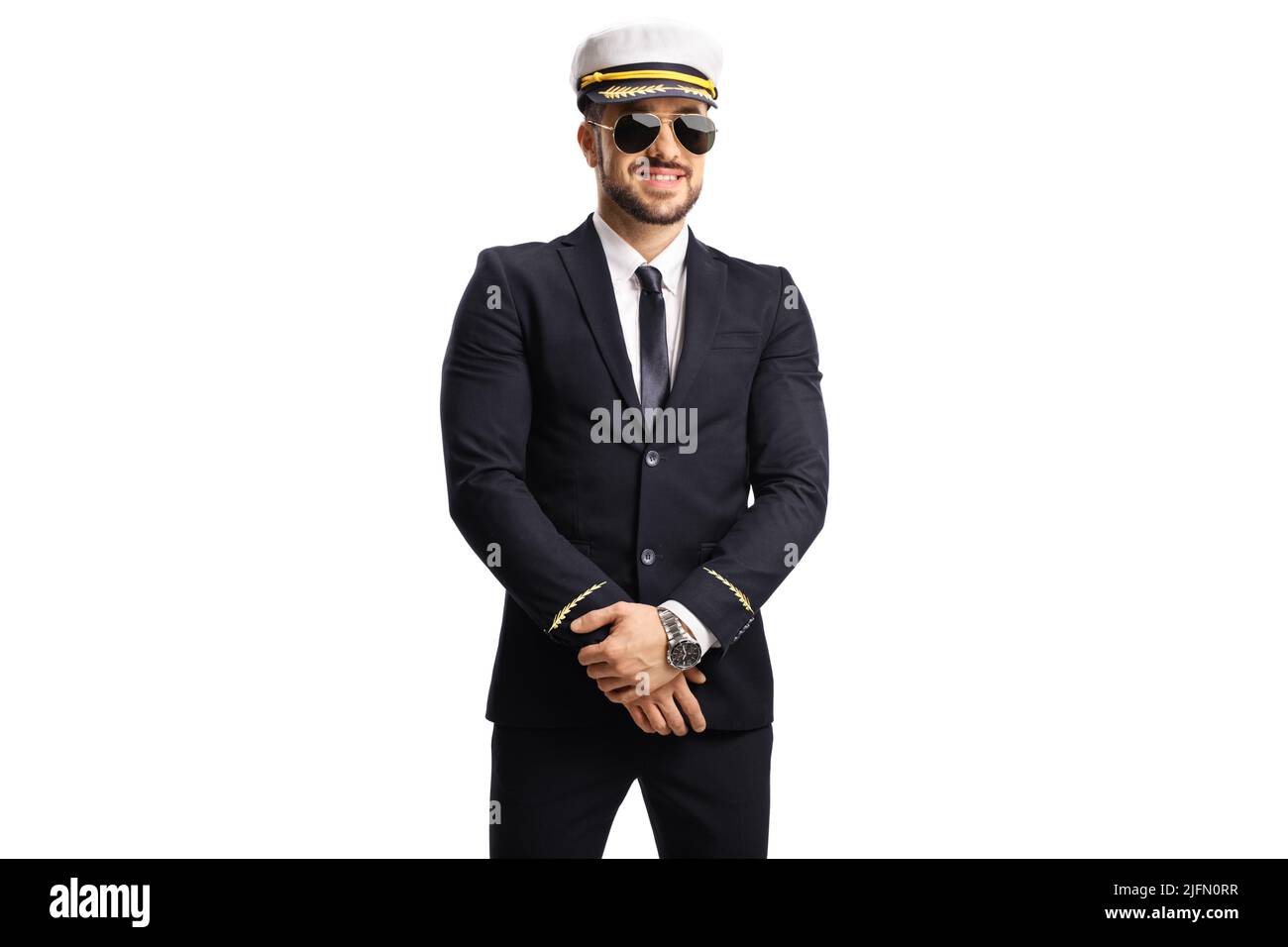 Junge Pilotin in Uniform, trägt Sonnenbrille und posiert isoliert auf weißem Hintergrund Stockfoto