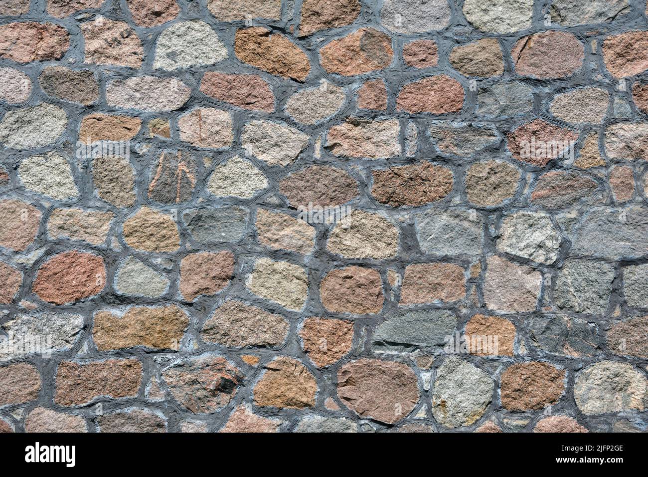 Textur einer alten Steinmauer. Steinwall Hintergrund. Stockfoto