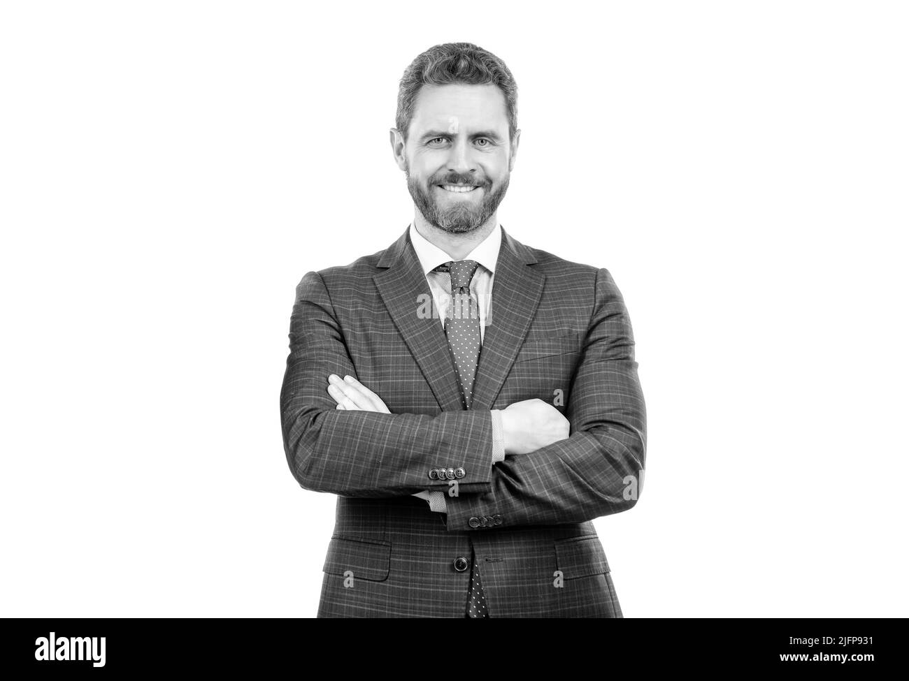 Vertrauen in das Unternehmen. Geschäftsmann lächelt mit gekreuzten Armen. Vertrauen und Professionalität Stockfoto