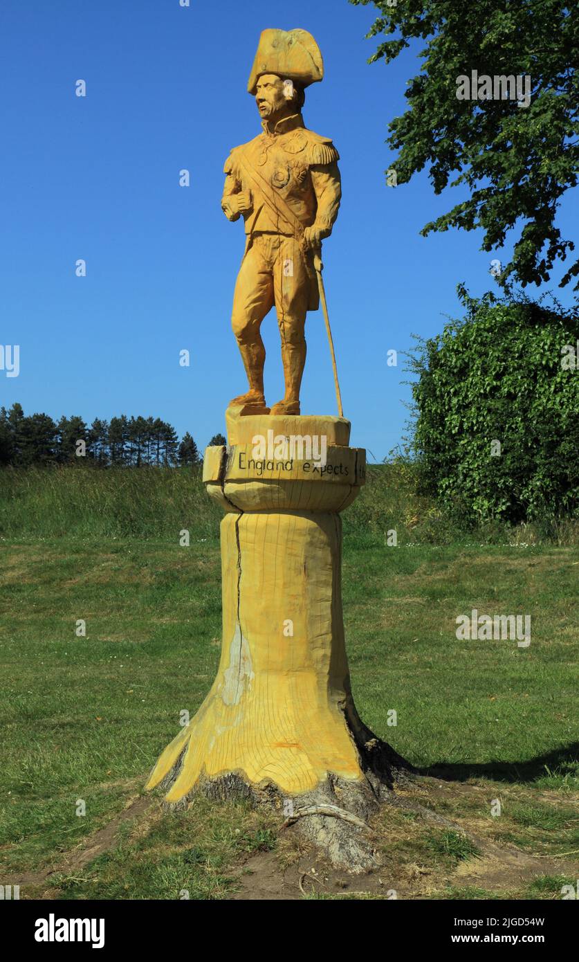 Admiral Lord Horatio Nelson, Holzskulptur, Schnitzerei, Burnham Thorpe, von Kettensägen-Künstler Henry Hepworth-Smith, aus norwegischem Ahornstamm Stockfoto