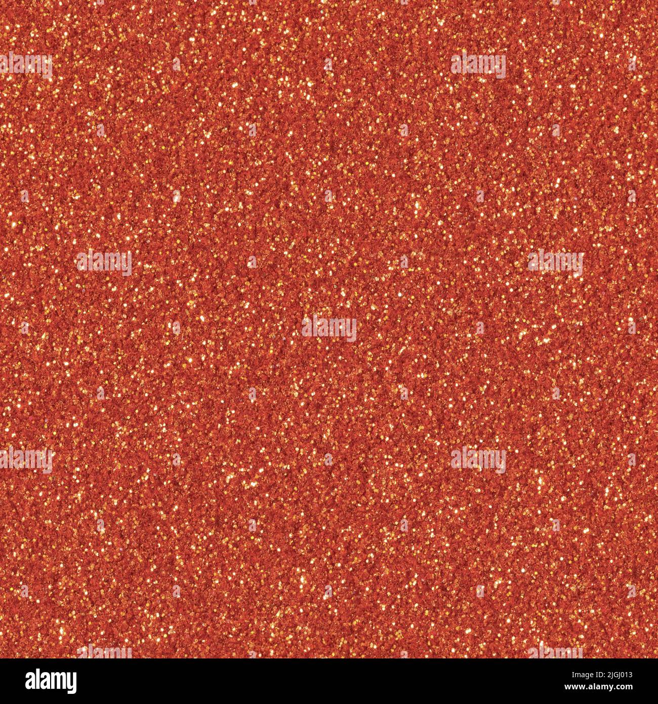 Orange Glitzer funkeln Weihnachten Hintergrund. Nahtlose Textur. Stockfoto