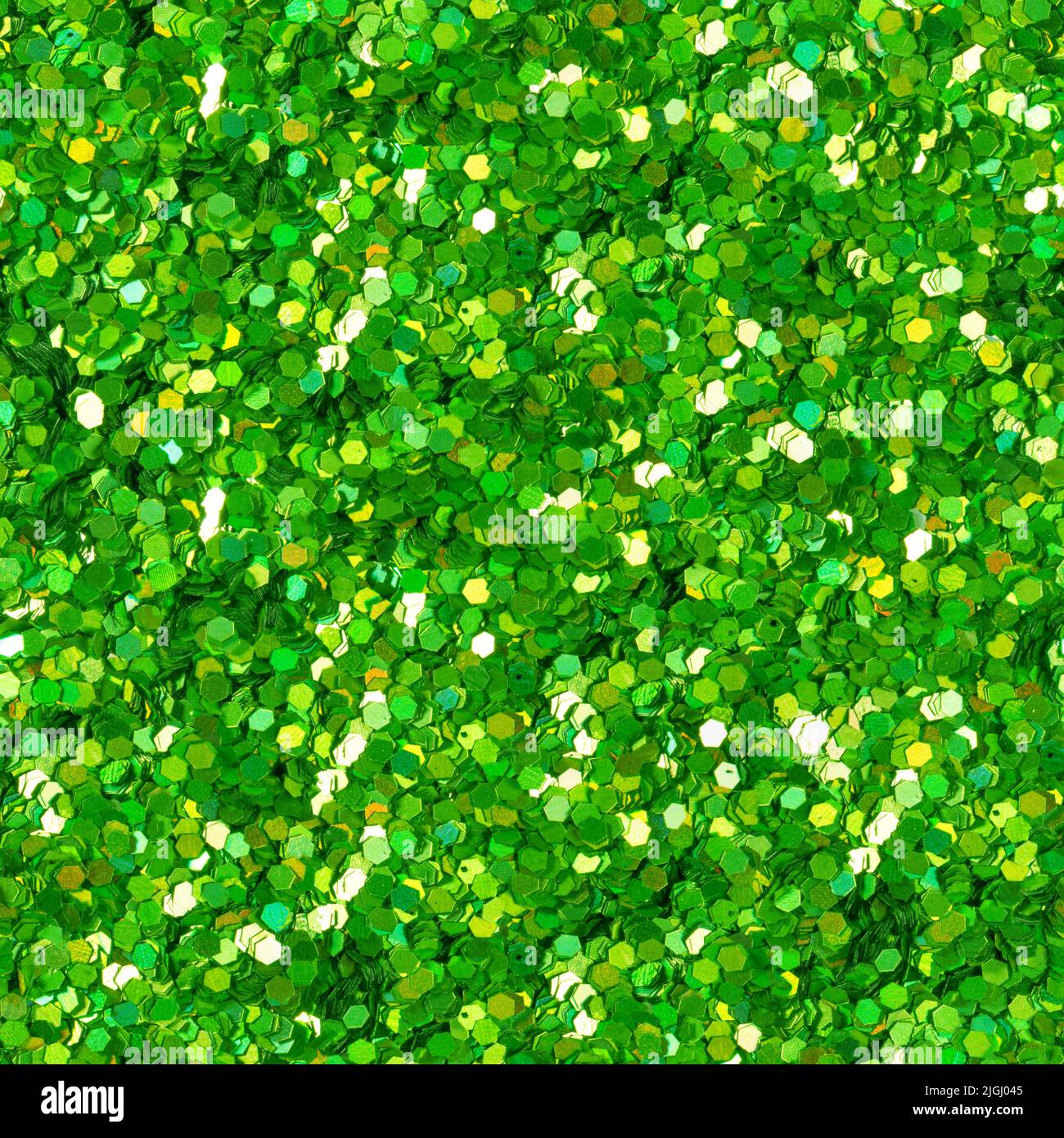 Grüne Glitzerstruktur. Material für einzigartige Kunstwerke. Stockfoto
