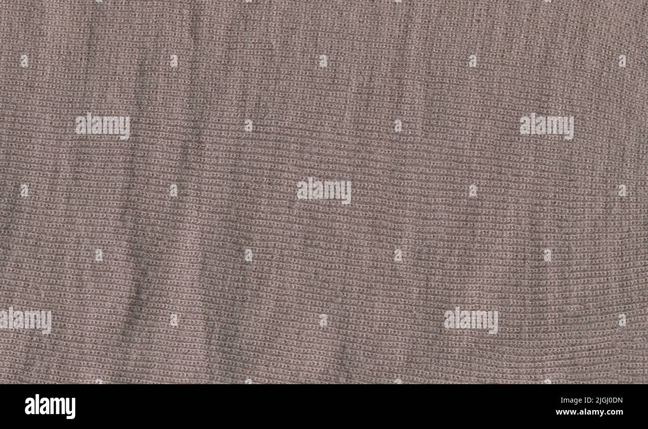 Winter taupe grau schlichter Stoff Wolle Schal Muster. Steingrau gefärbter Wollpullover-Struktur. Stockfoto