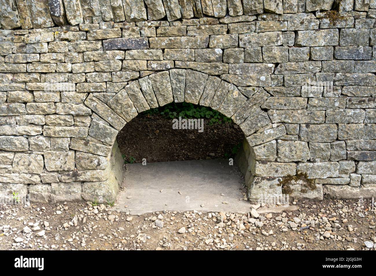 Ein lunky, auch bekannt als Kriechloch oder Schwein-Loch, für einen Landwirt verwendet, um den Durchgang von Schafen von einem Feld zum anderen in Großbritannien zu kontrollieren. Stockfoto