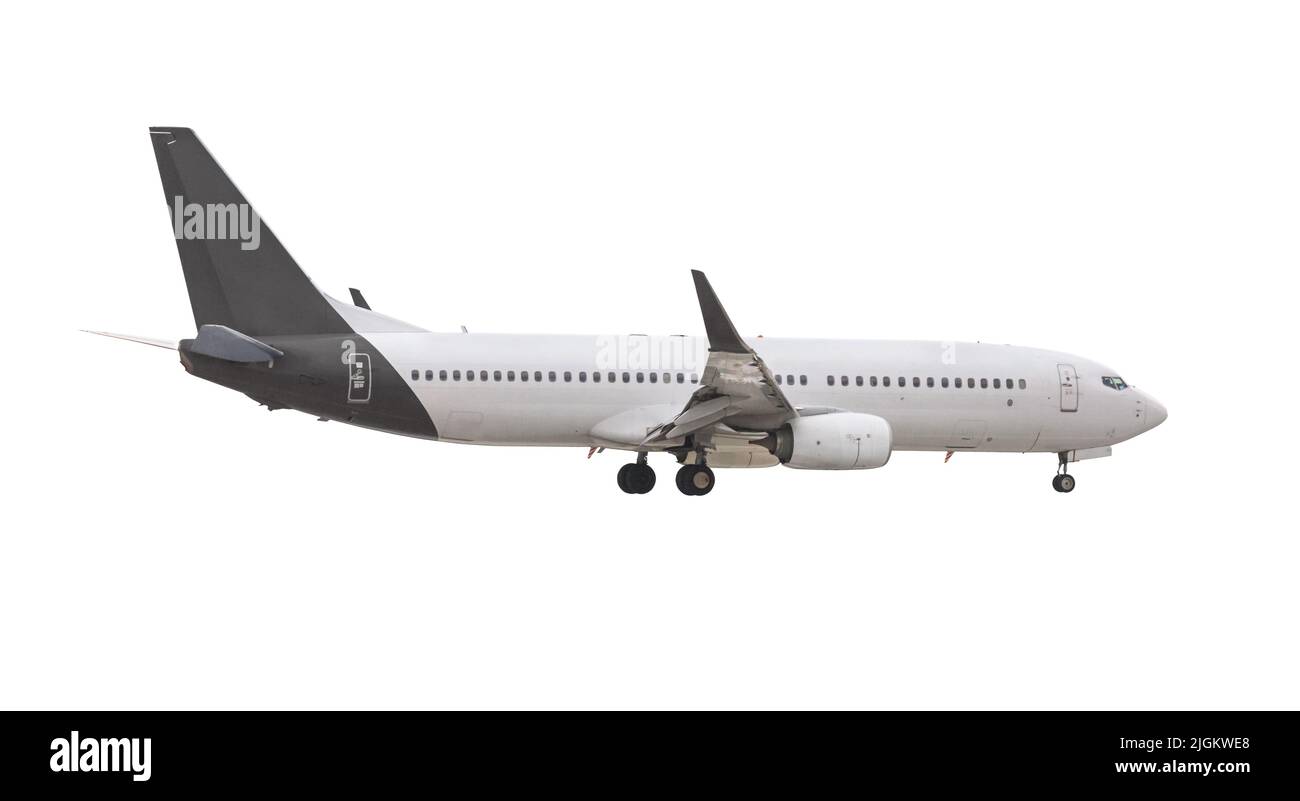 Modernes Passagierflugzeug während des Fluges, isoliert auf weißem Hintergrund, Seitenansicht aus der Nähe Stockfoto