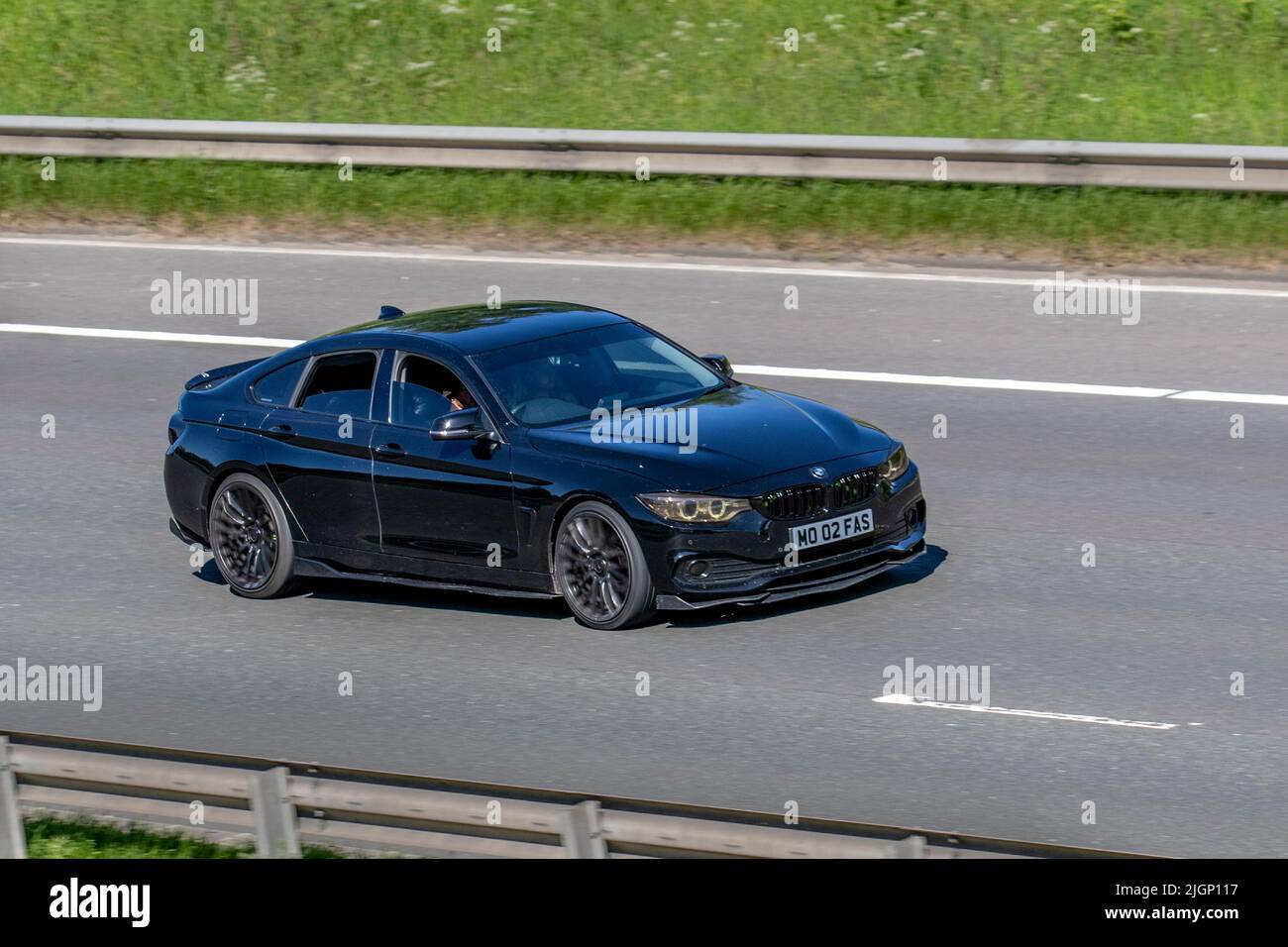 2014 schwarzer BMW 418D Gran Coupe SE Start Stop 1995cc Diesel Hatchback; unterwegs auf der M61 Motorway, Manchester, UK Stockfoto