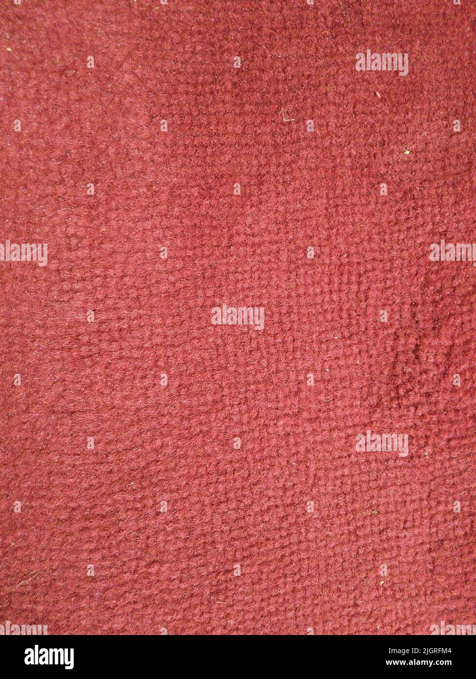 Abstrakter Teppich Hintergrund in rot Stockfoto