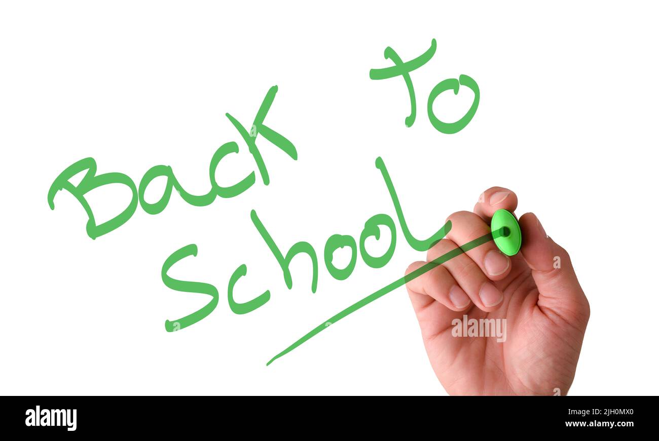 Handschrift in der Luft auf dem Bildschirm zurück zur Schule mit einem grünen Marker mit isoliertem weißen Hintergrund Stockfoto