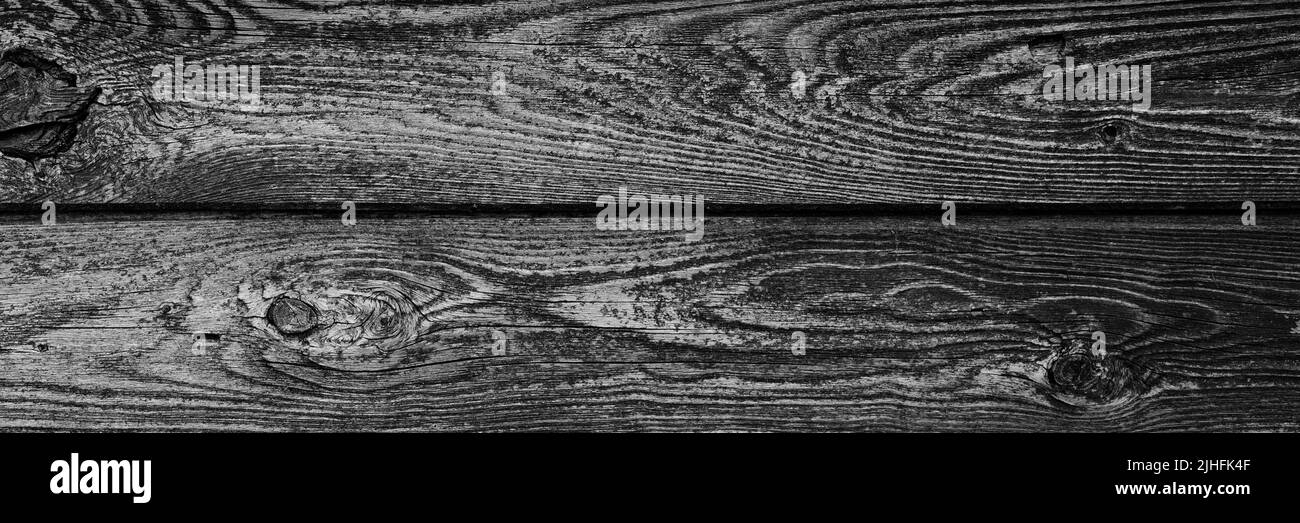 Der Hintergrund ist in schwarz und grau getönt von alten Holzbrettern. Mockup. Banner Stockfoto