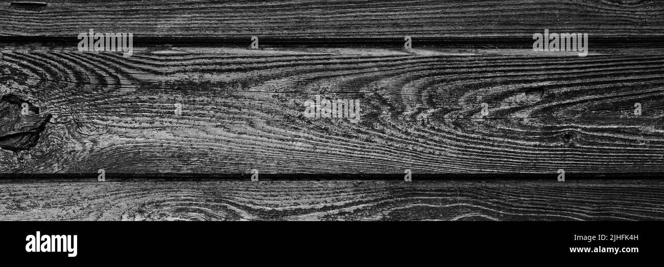 Der Hintergrund ist in schwarz und grau getönt von alten Holzbrettern. Mockup. Banner Stockfoto
