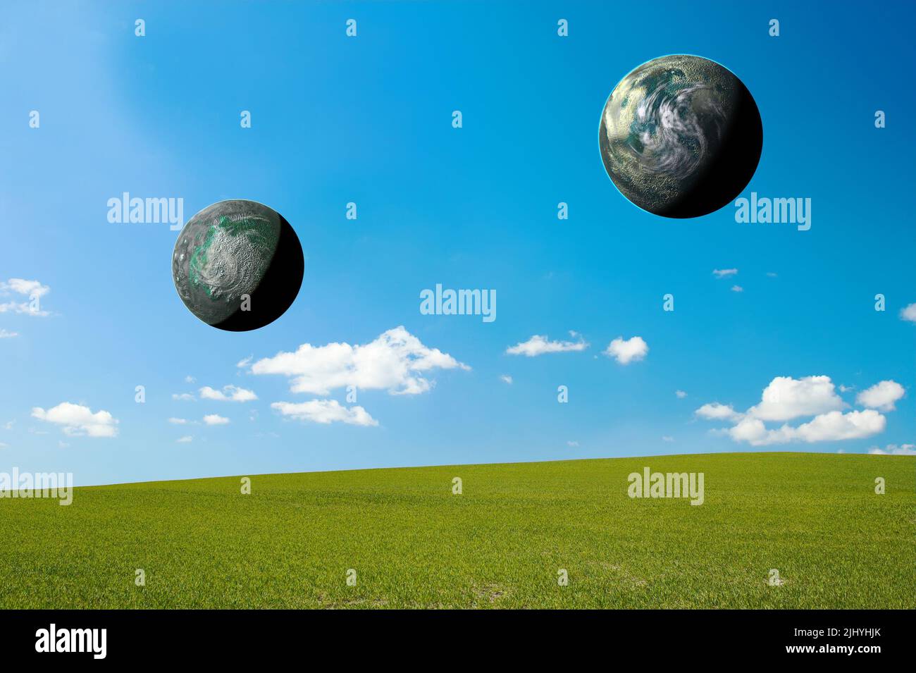 Zwei 3D Sonnenplaneten, die den Welt- oder Erdtag symbolisieren, universelles Ökosystem in abgelegener Landschaft, Feld oder Wiese. Astrophysik oder himmlische Studie der Wohnung Stockfoto