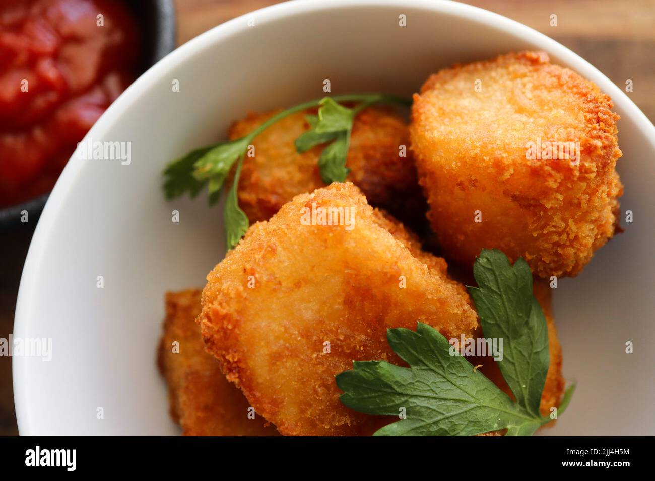 Kartoffelwürze mit Petersilie Stockfoto
