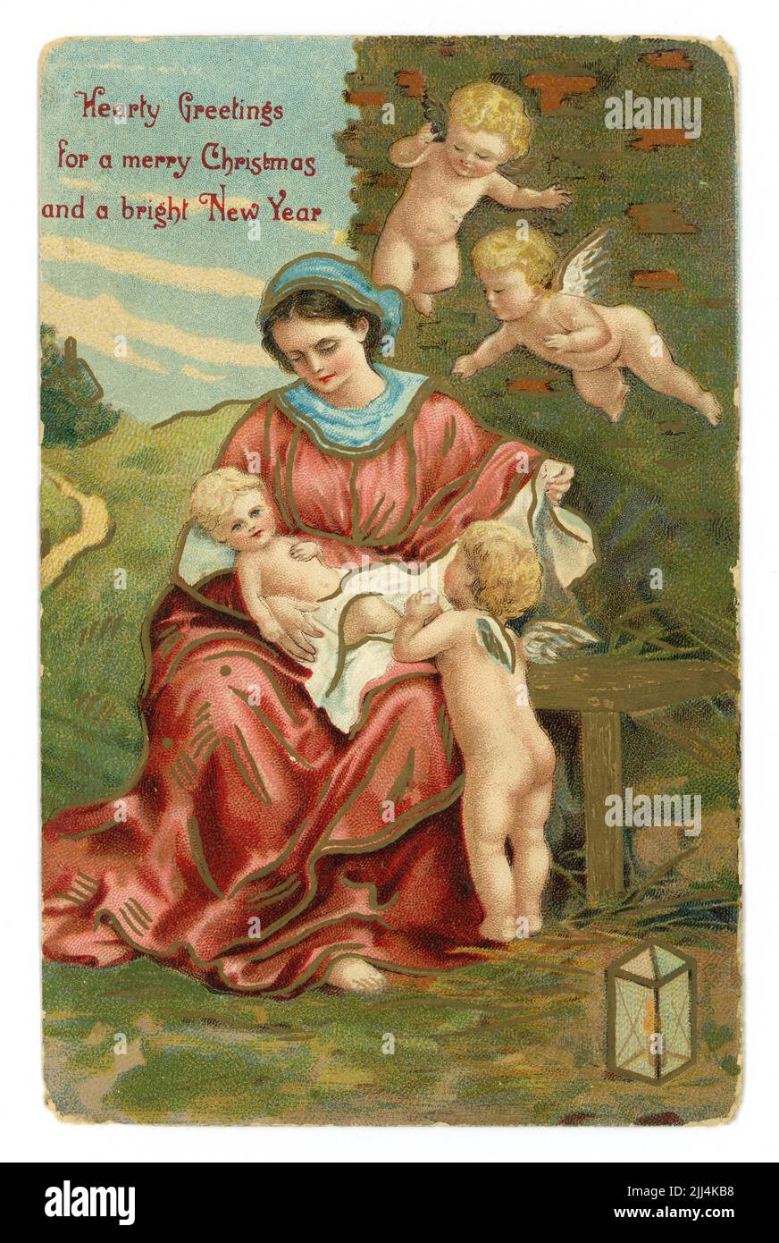 Original geprägte edwardianische Ära Weihnachtsgrüße und bebilderte Farbpostkarte mit Maria, die das Jesuskind hält, veröffentlicht /datiert 21. Dezember 1910 Stockfoto