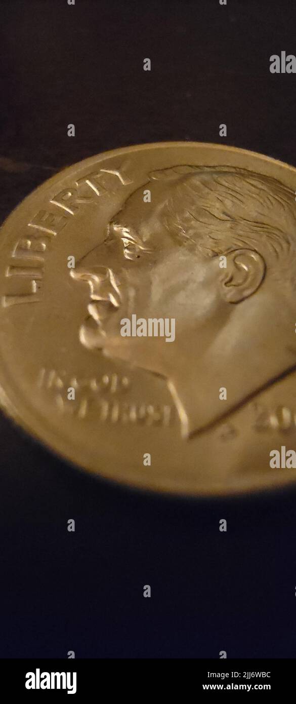 Alte goldene Münze - Freiheit, auf Gott vertrauen wir Stockfoto