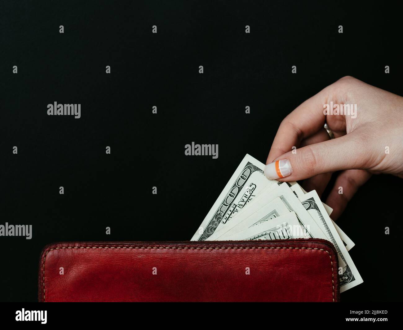 Konsumdenken Geld ausgeben Dollar Geldbörse Stockfoto