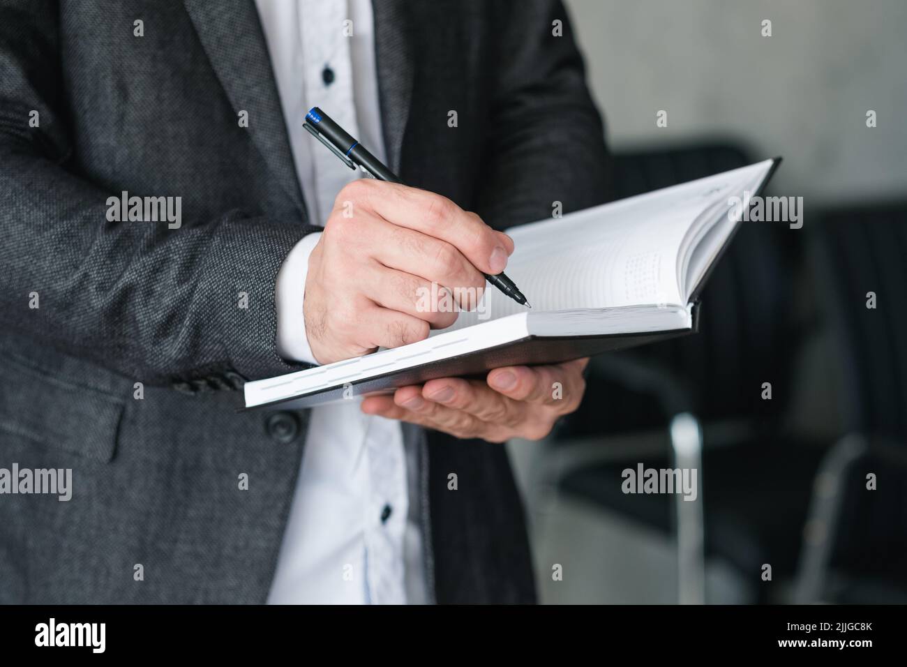 Mann Hand schreiben Notebook Business-Planung Agenda Stockfoto