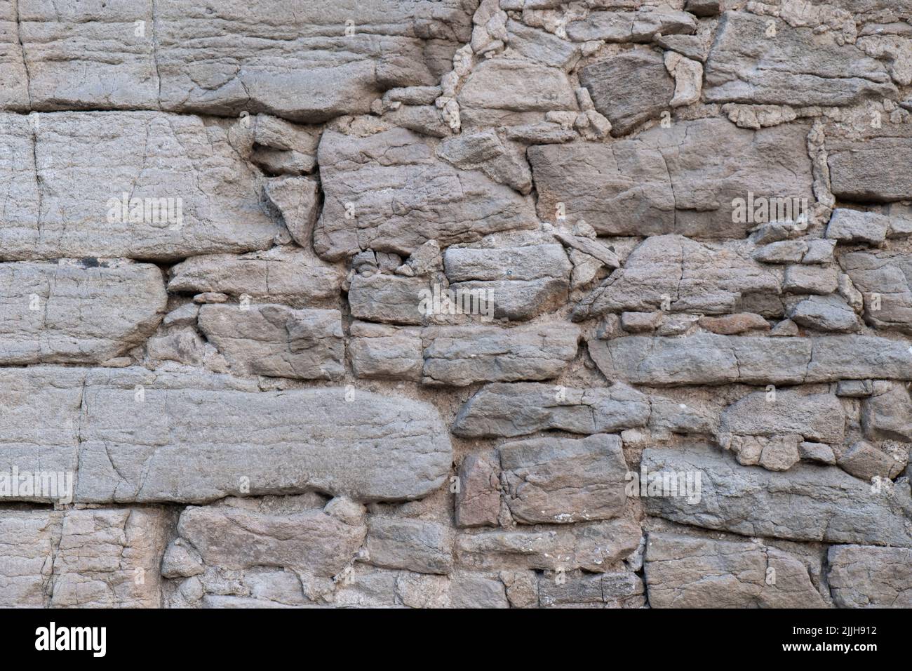 Massive Steinmauer Hintergrund. Alte Burg Felswand. Stockfoto