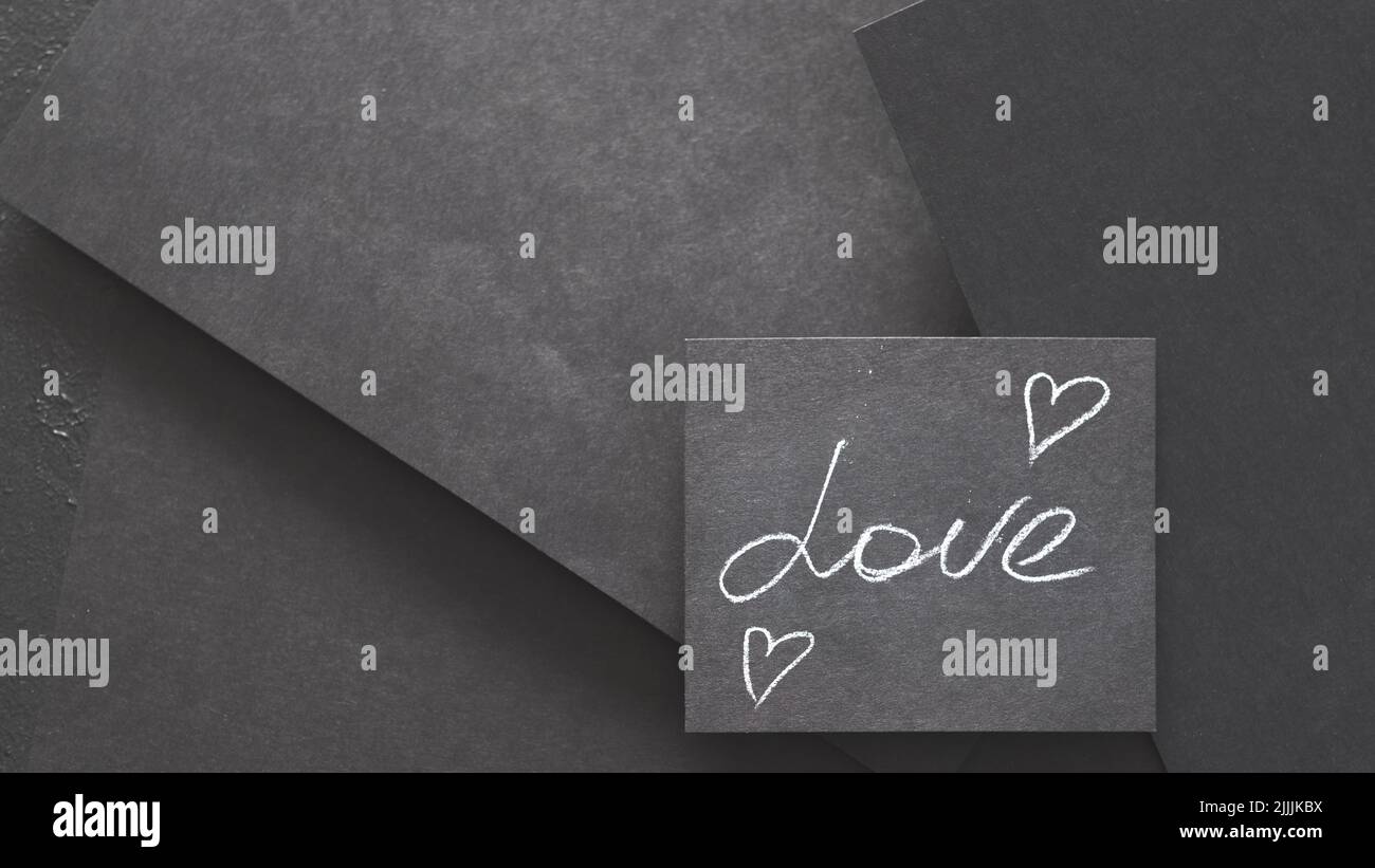 Liebe Herzen Gefühle Romantik Kreide schwarzes Papier Stockfoto