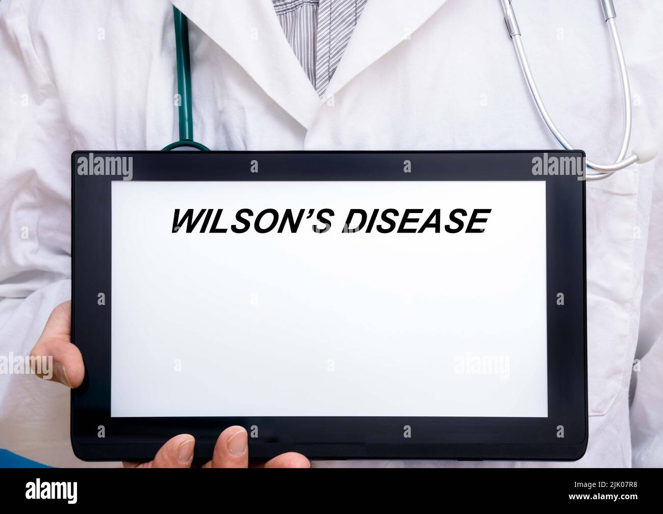 Wilson-Krankheit. Arzt mit seltener oder verwaister Krankheit Text auf dem Tablet-Bildschirm Wilson%E2%80%99s Krankheit Stockfoto