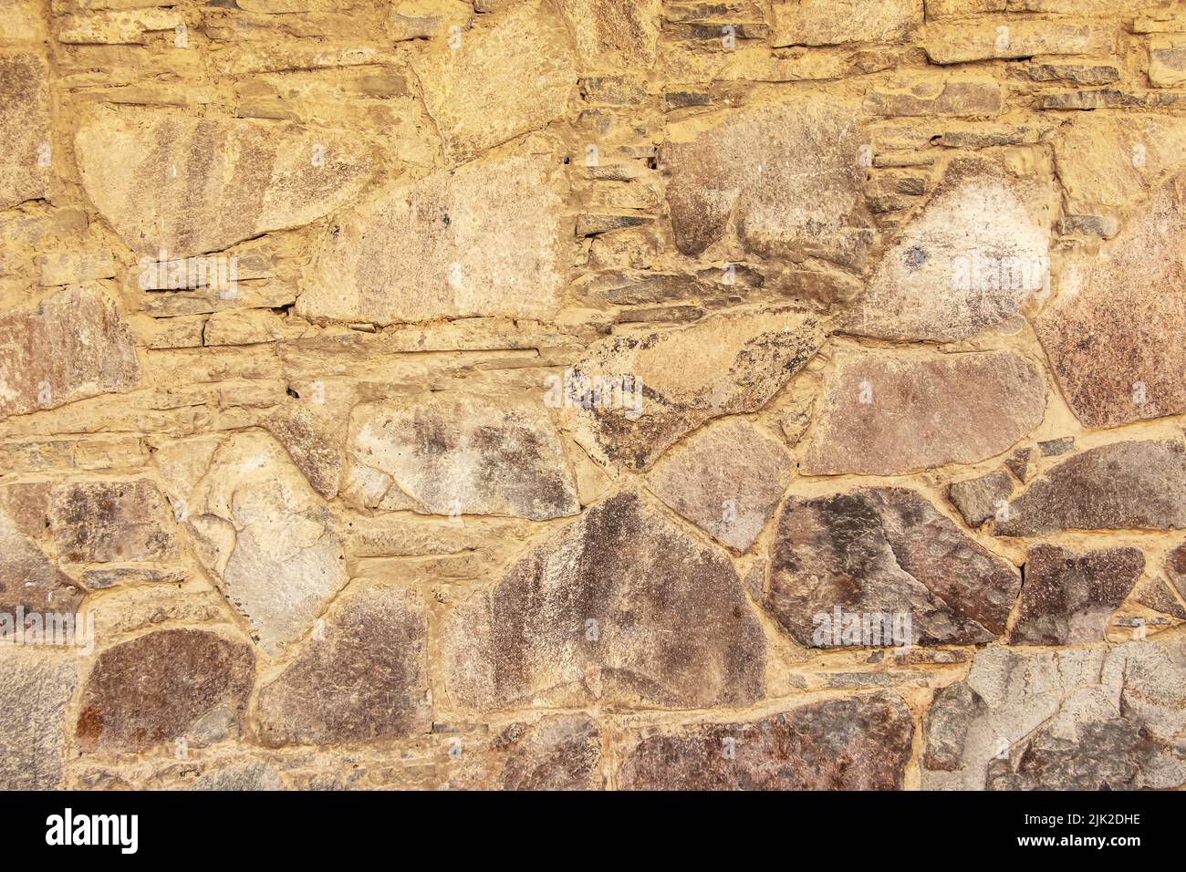 Die Textur der Steinmauer. Hintergrundstruktur der Steinmauer des alten Gebäudes. Steinmauer als Hintergrund oder Textur. Stockfoto Die Textur der Steinmauer. Hintergrundstruktur der Steinmauer des alten Gebäudes. Steinmauer als Hintergrund oder Textur. Stockfoto
