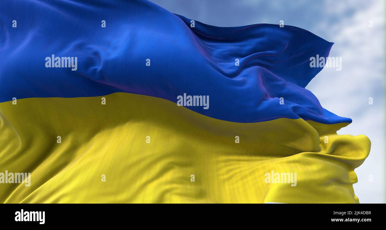 Detail der im Wind winkenden Nationalflagge der Ukraine. Demokratie und Politik. Patriotismus. Selektiver Fokus. Nahtlose Zeitlupe Stockfoto