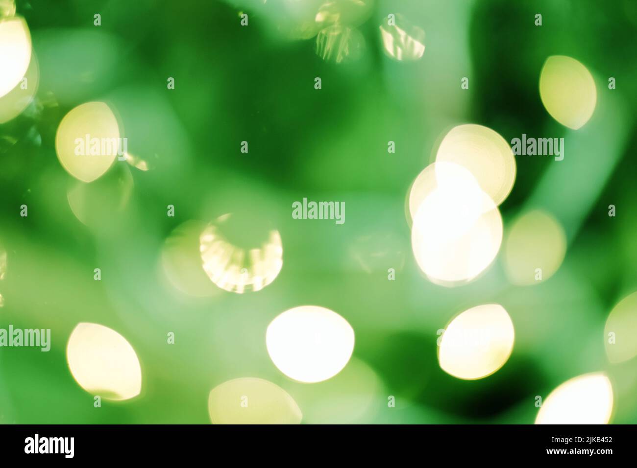 Blur goldenen Schein Kreis leuchtet grünen Hintergrund Stockfoto