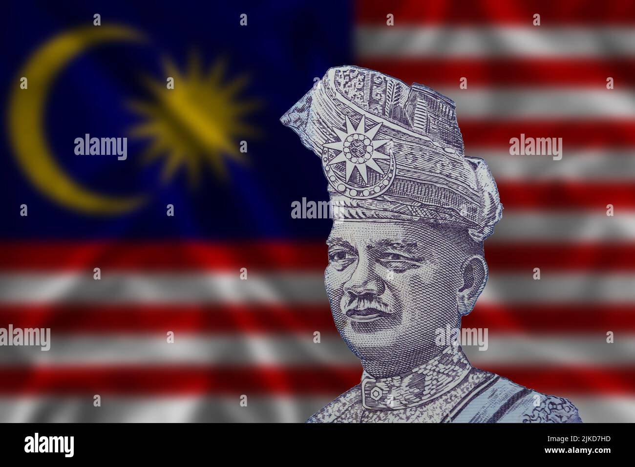 Tunku Abdul Rahman auf dem Hintergrund der malaysischen Flagge. Das Porträt des Premierministers auf der malaysischen 1-Ringgit-Banknote. Stockfoto