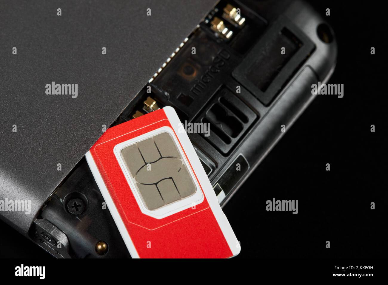 SIM-Karte auf dem Smartphone Stockfoto