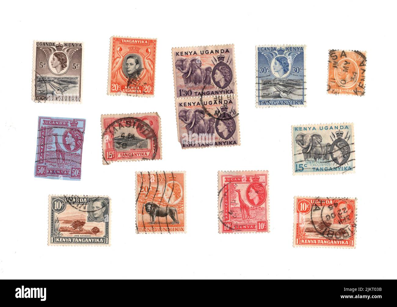 Eine Auswahl alter Briefmarken aus Kenia, Uganda und Tanganjika auf weißem Hintergrund. Stockfoto