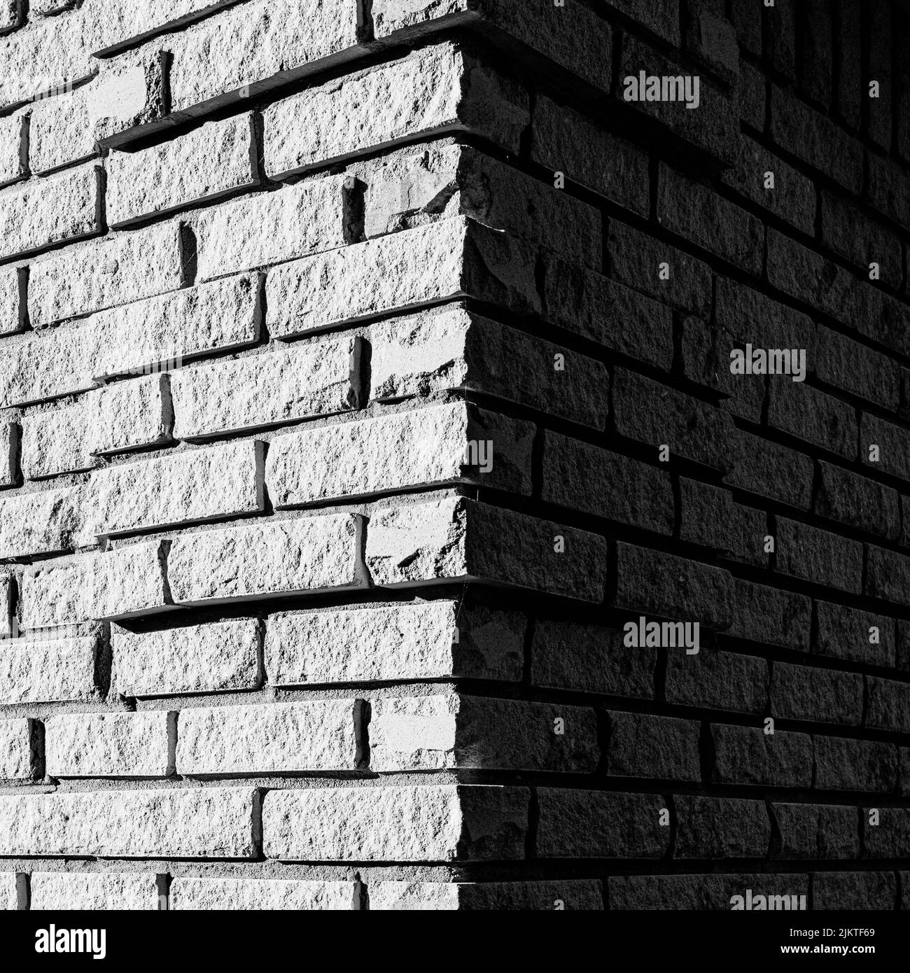 Nahaufnahme eines grauen Backsteinwandtextur-Hintergrunds Stockfoto