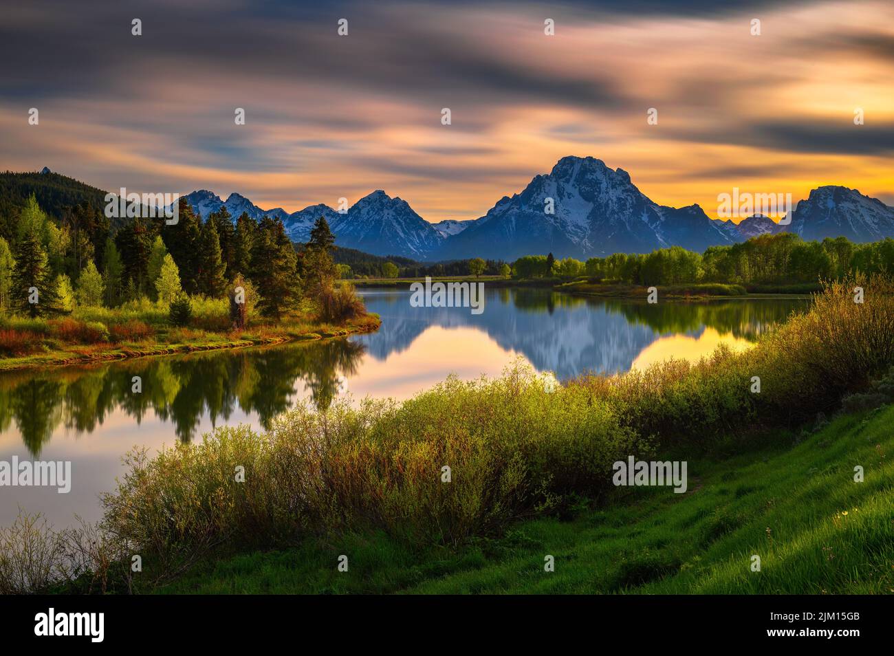 Sonnenuntergang über dem Oxbow Bend des Snake River im Grand Teton National Park, Wyoming Stockfoto