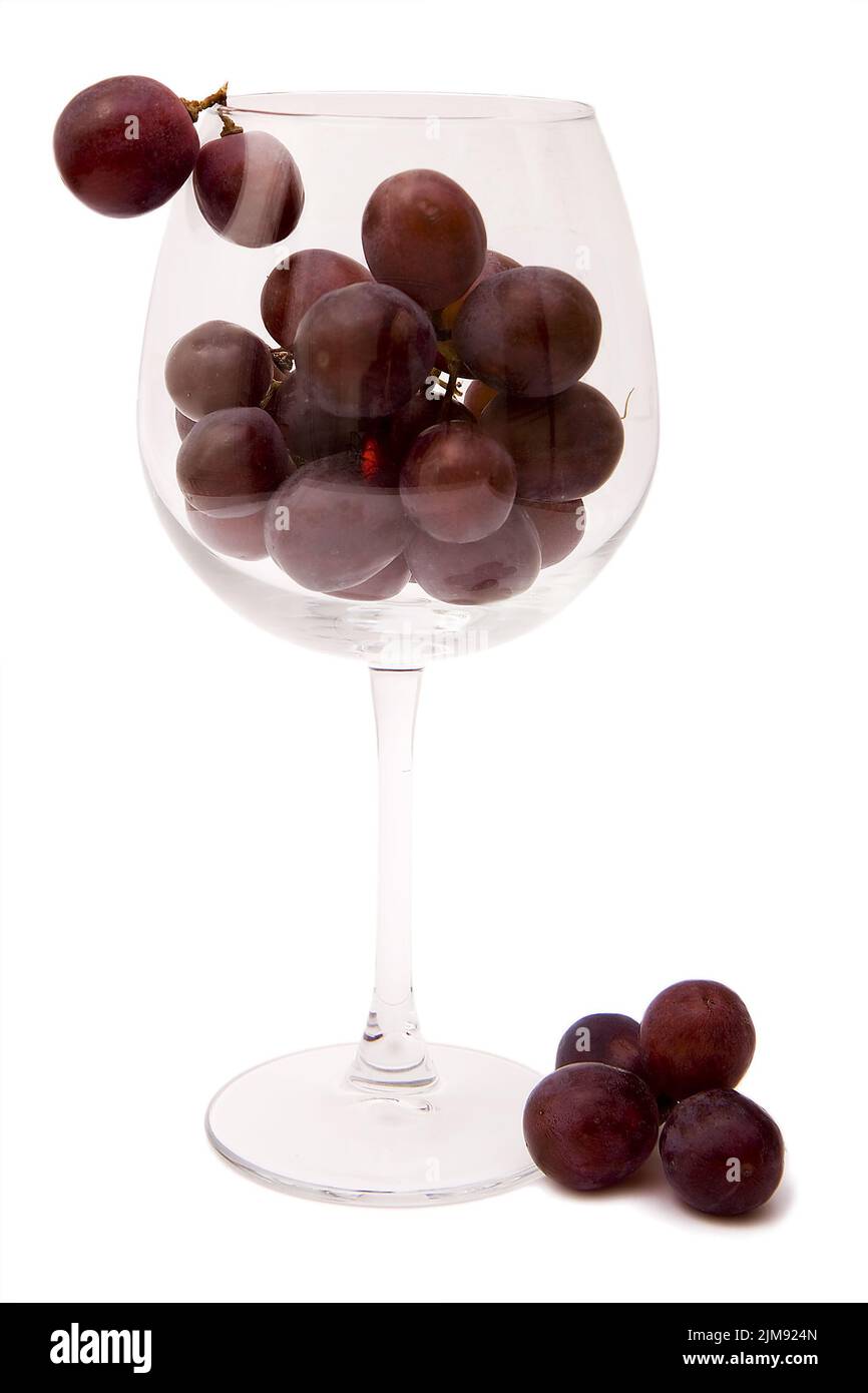 Trauben in ein Glas Wein Stockfoto
