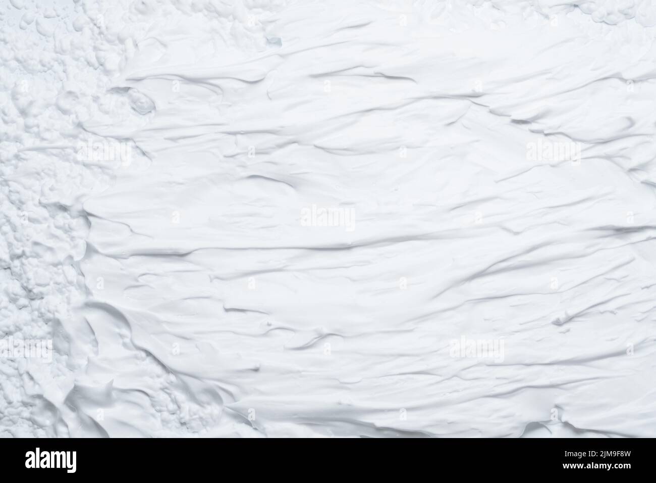 Weiße Schaumstoff Textur Hintergrund verschmiert Creme Stockfoto