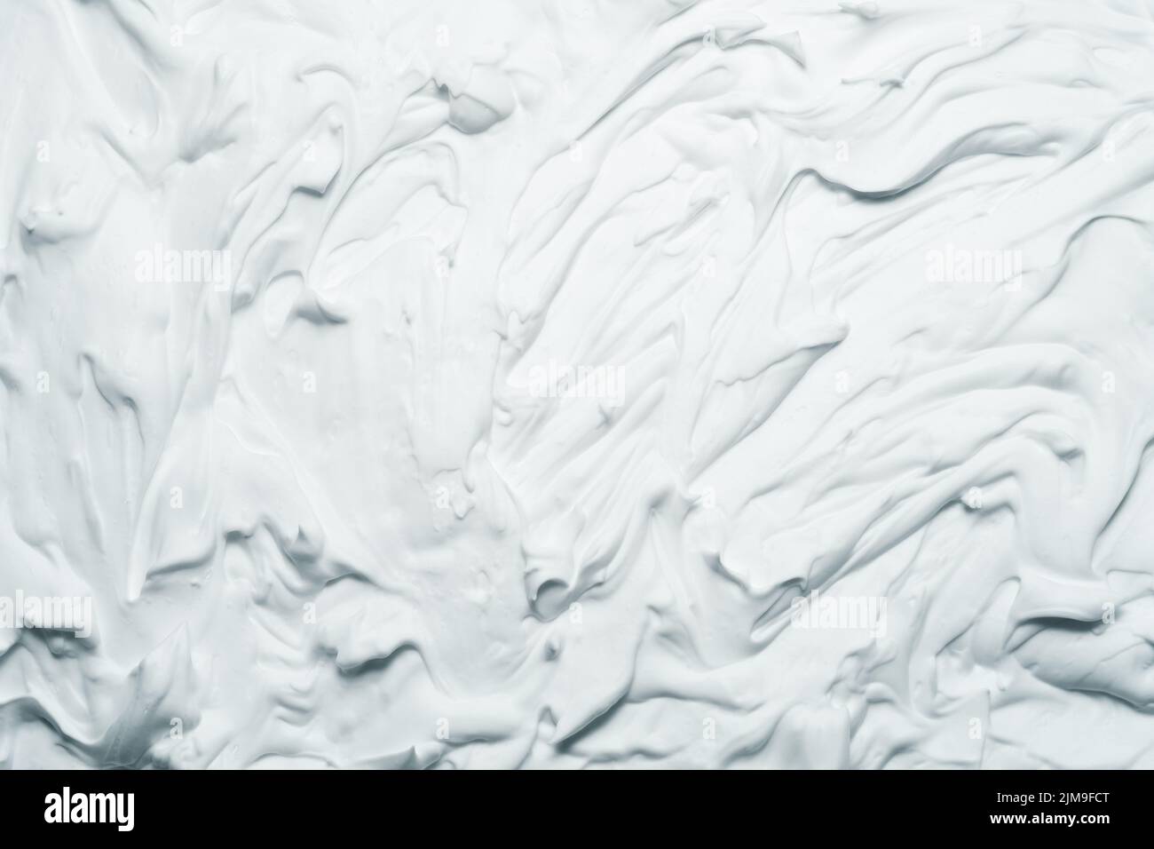 Weiße Schaumstoff Textur Hintergrund verschmiert Creme Stockfoto