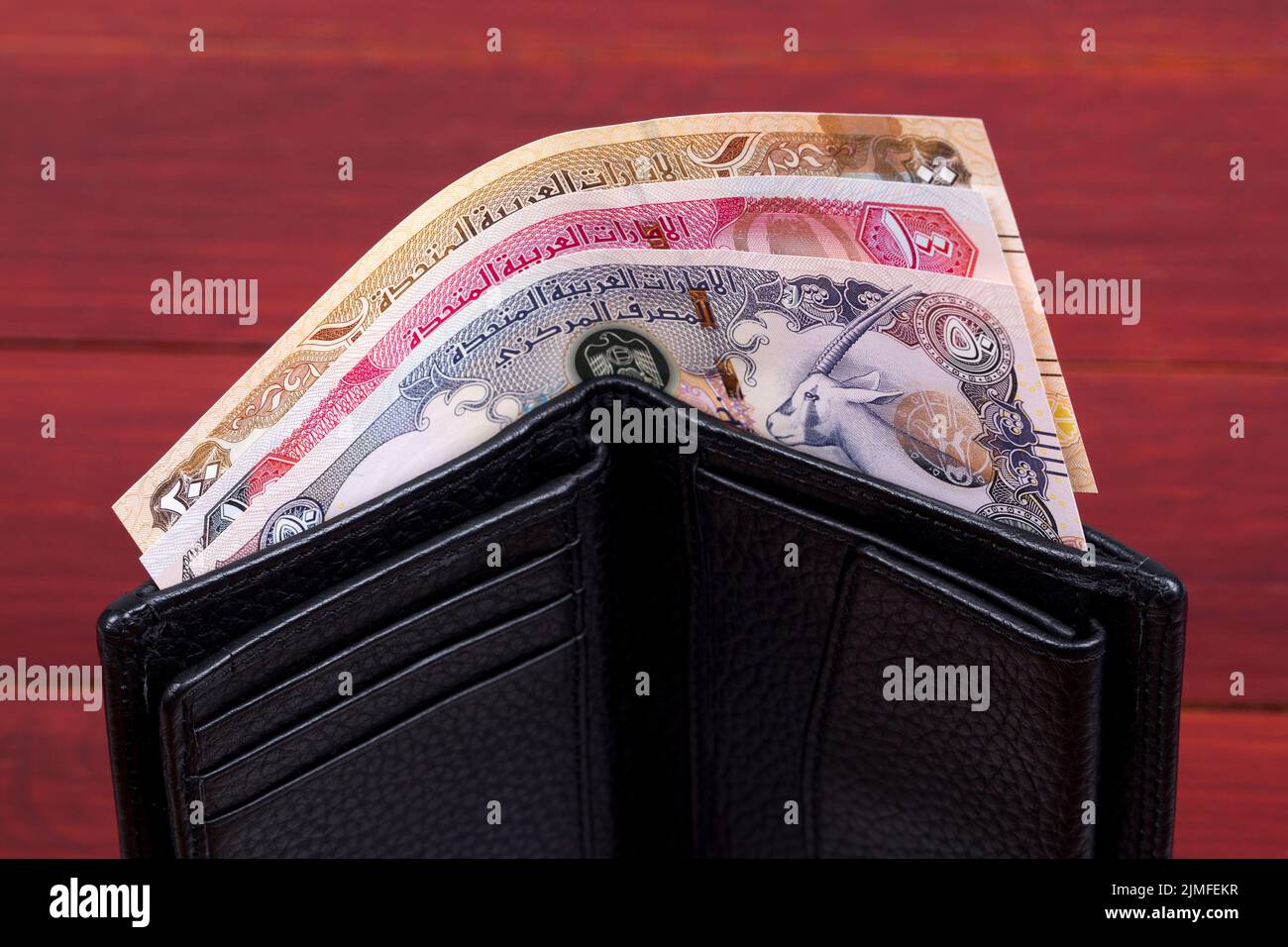 Vereinigte Arabische Emirate Geld in der schwarzen Brieftasche Stockfoto