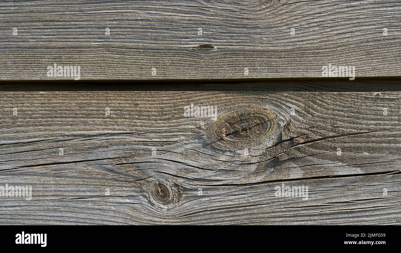 Holzbretter auf einem alten verwitterten Zaun Stockfoto