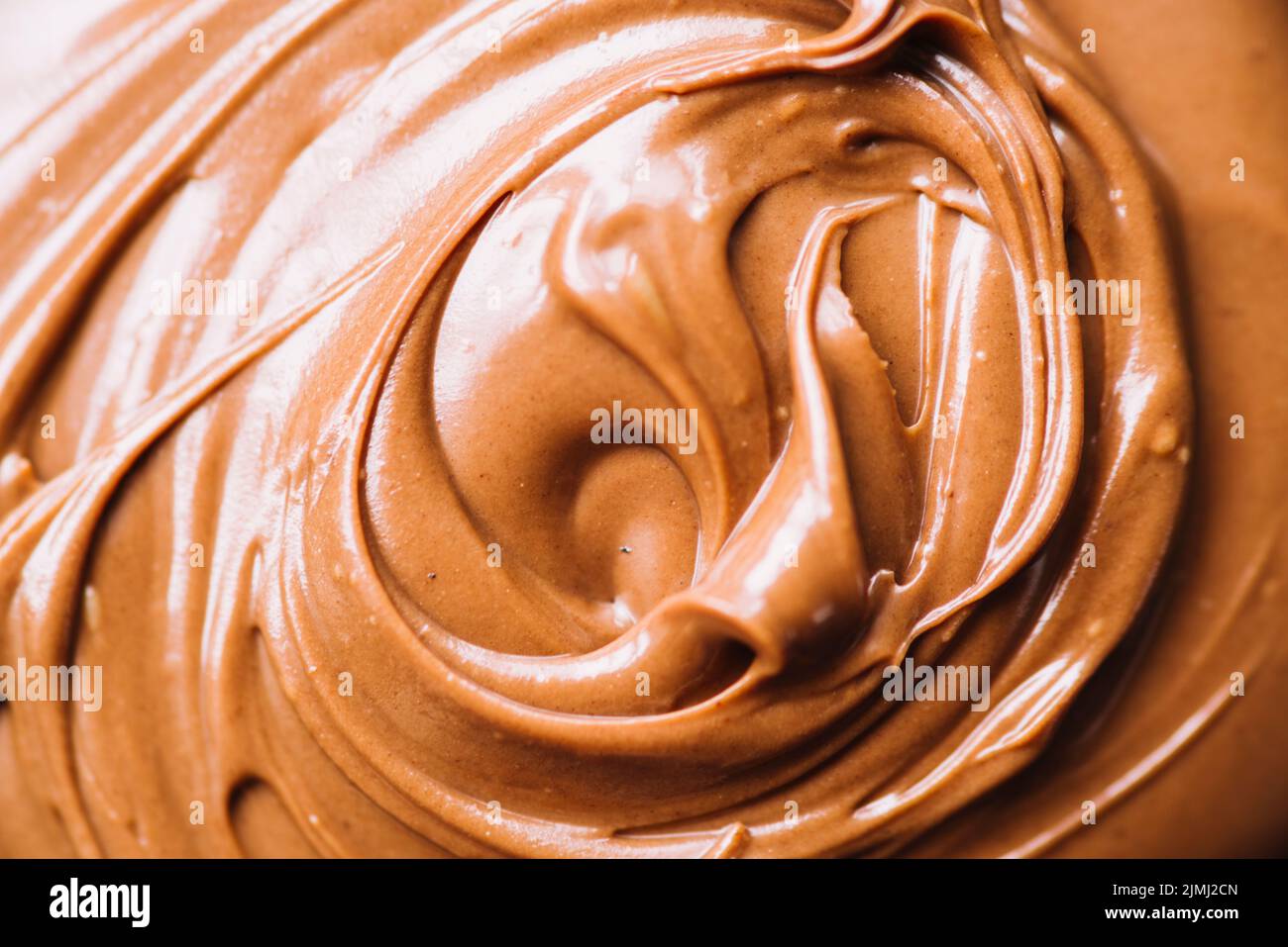 Geschmolzene Schokolade wirbeln Hintergrund Stockfoto