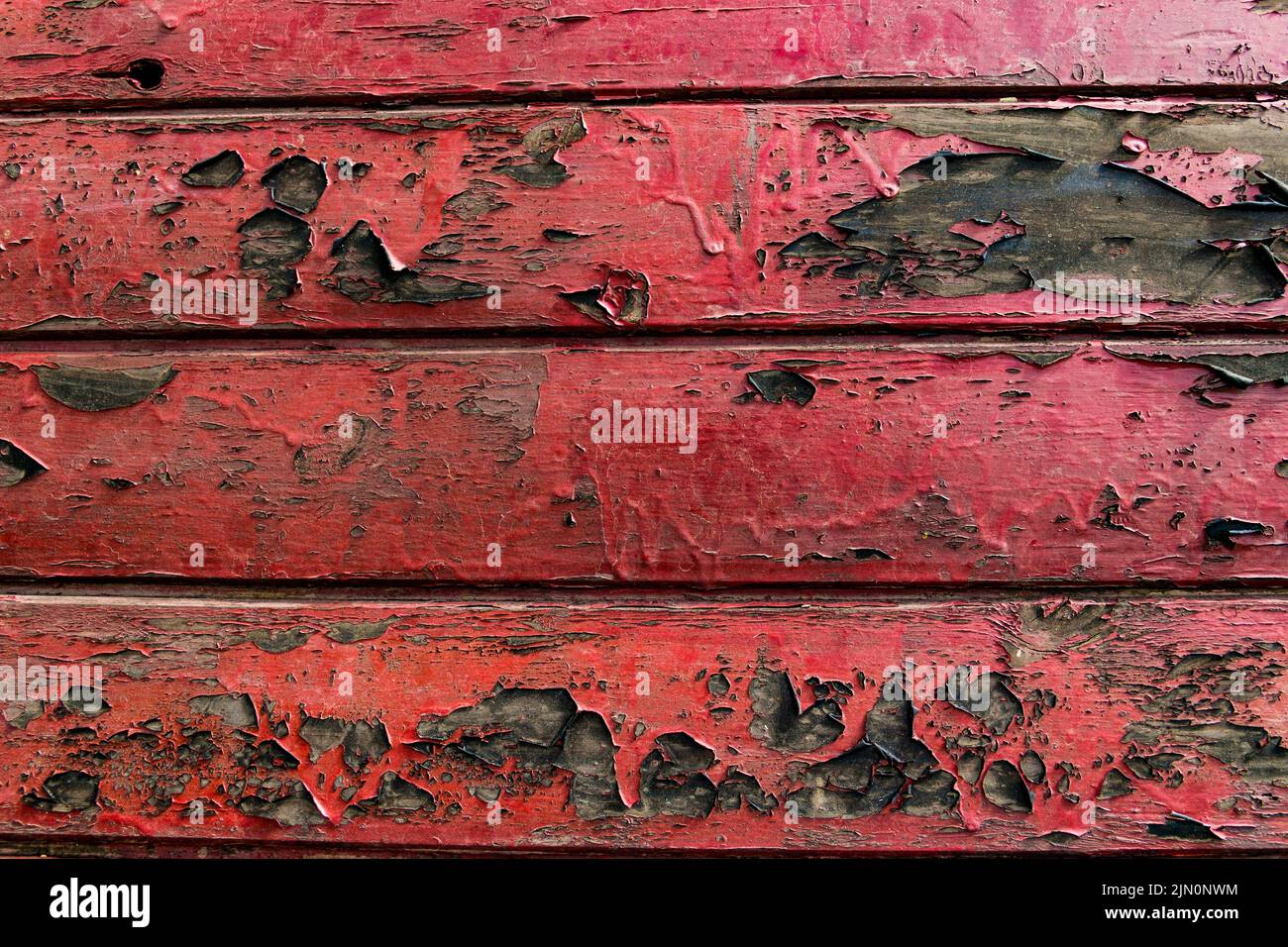 Rustikaler Hintergrund mit gealtertem rot lackiertem Holz Textur Stockfoto