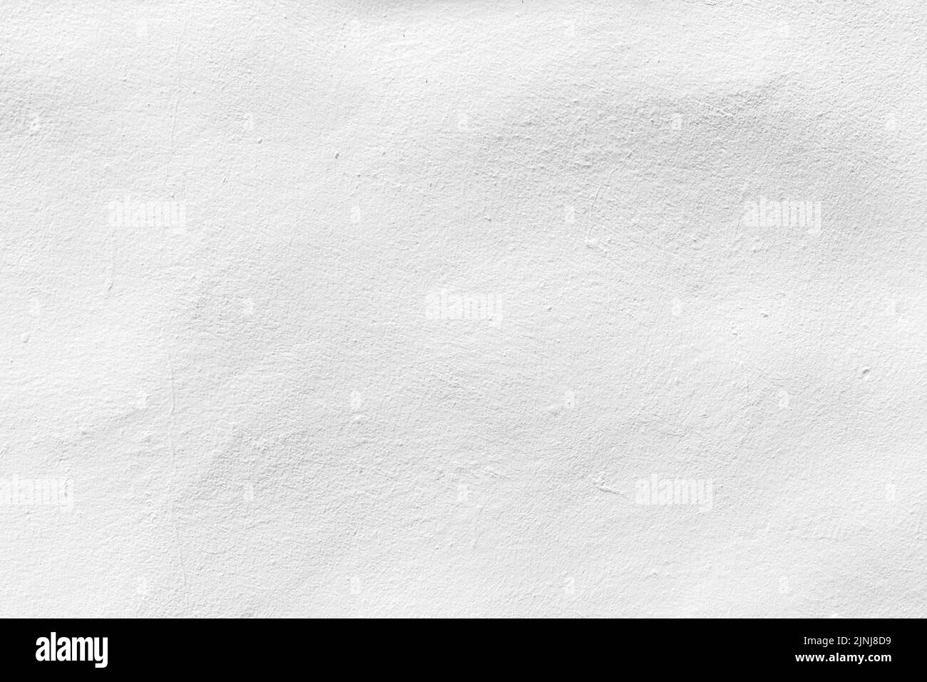 Weißer Beton oder Zementmaterial in abstrakter Wandhintergrundstruktur. Stockfoto