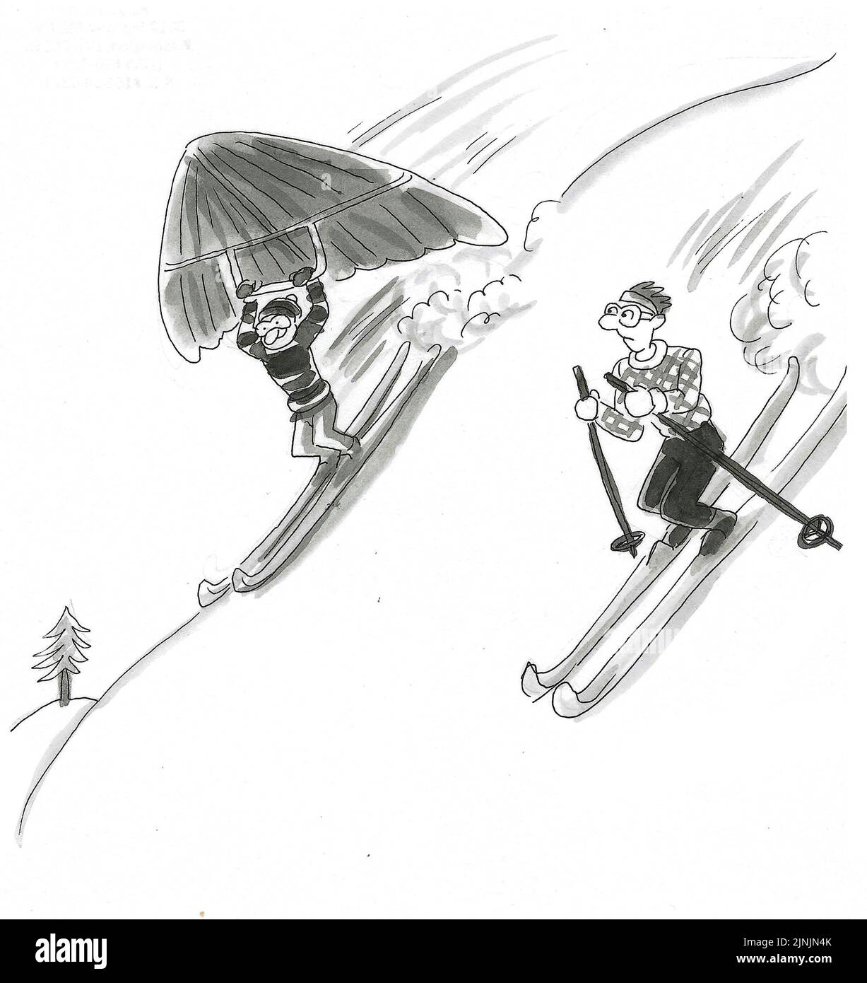 Ein Skifahrer sieht einen anderen Skifahrer, der kurz davor steht, zu gleiten. Stockfoto