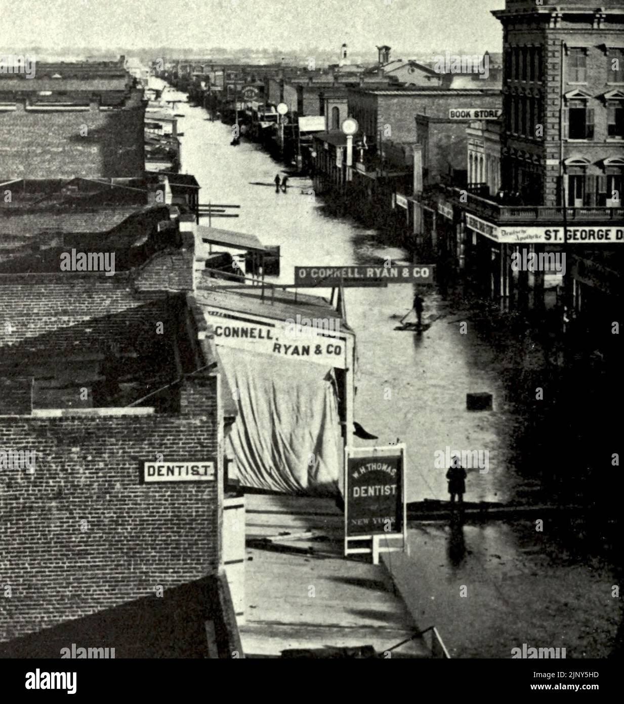 Sacramento City, Kalifornien, während der großen Flut von 1862 - J Street östlich der Third Street Stockfoto