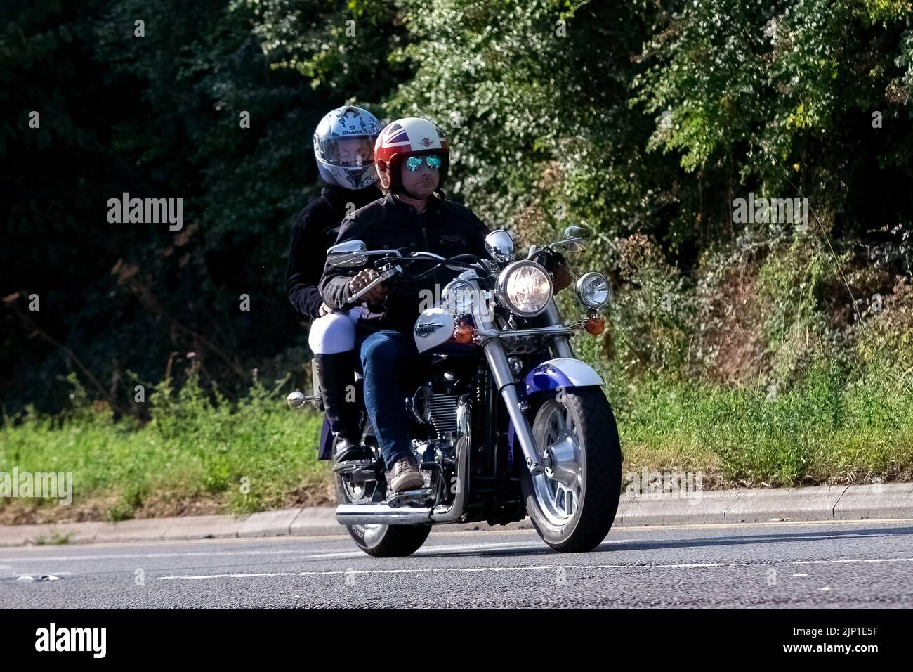 Triumph Motorrad mit Sozius Beifahrer Stockfoto
