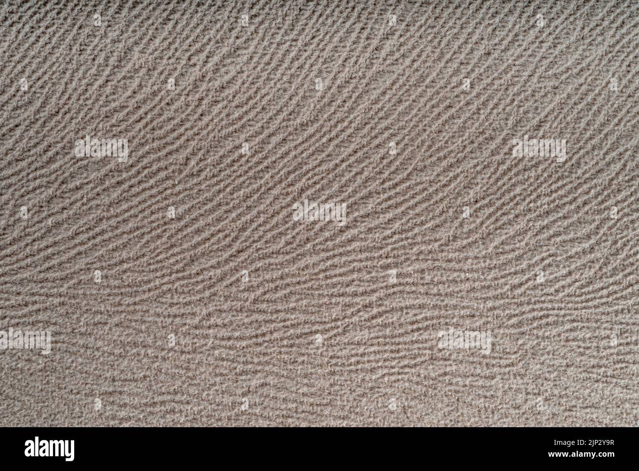 Ein beigefarbener Hintergrund mit Wandtextur Stockfoto