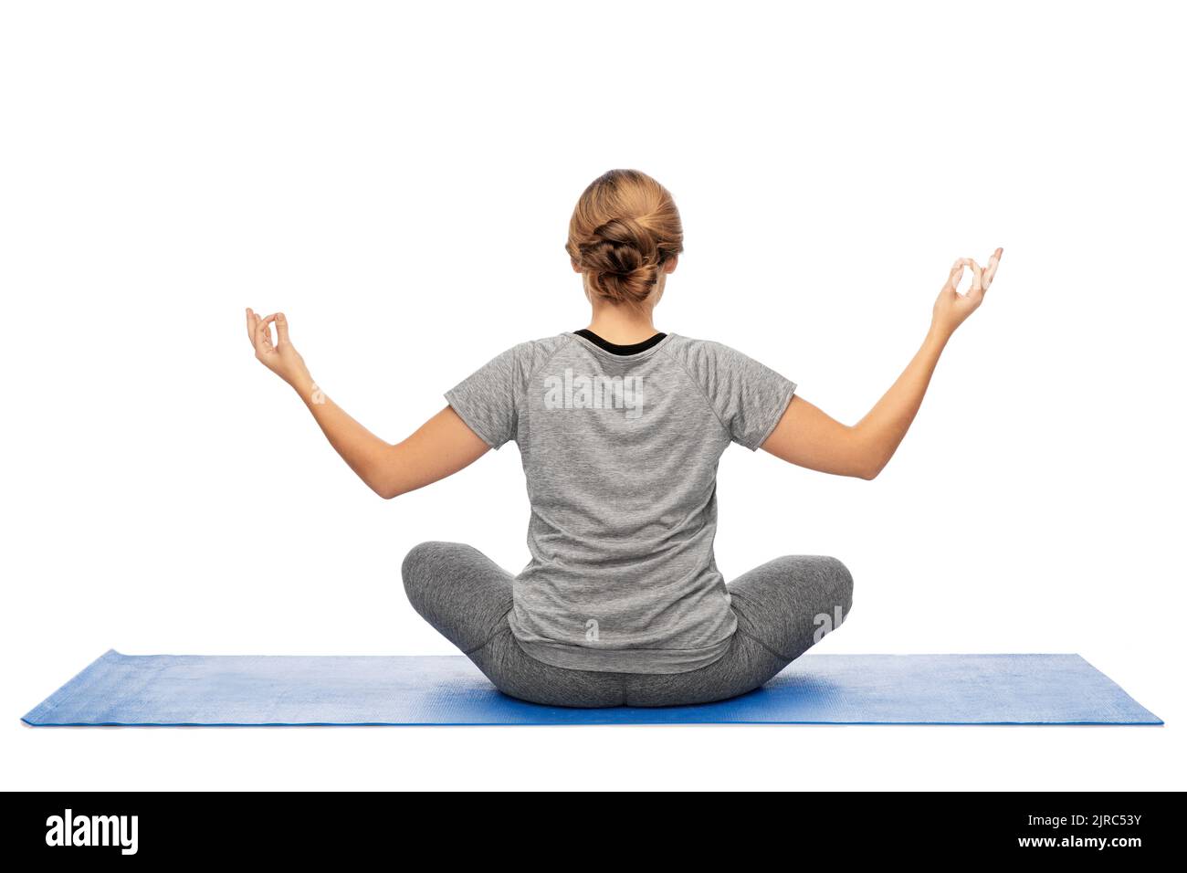 Frau, die Yoga in Lotushaltung macht Stockfoto